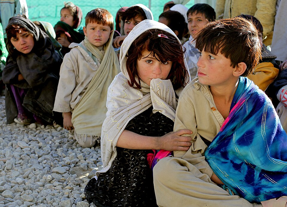 Children receiving gifts during a CCO event